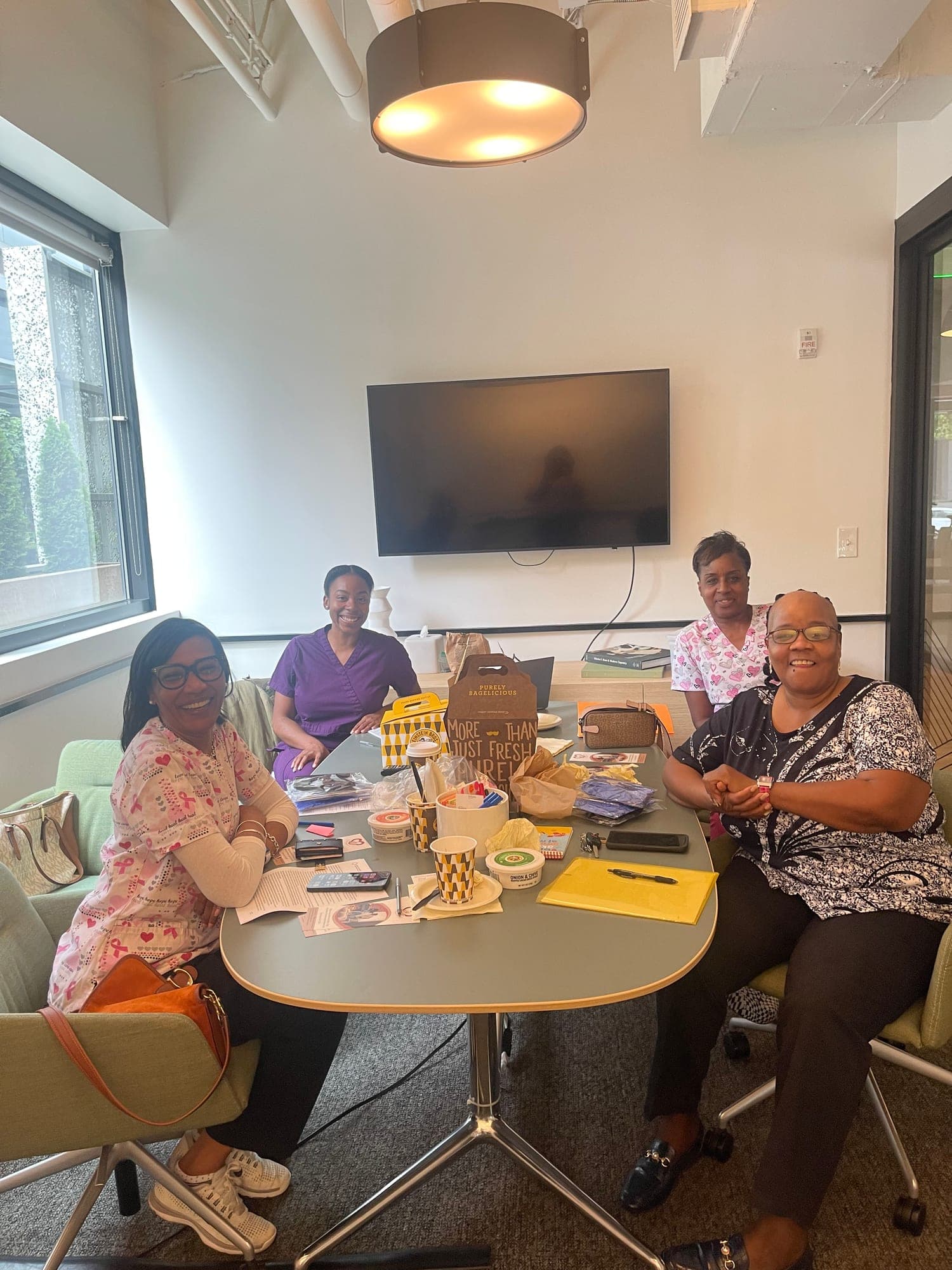 A group gathered around a table at a Healthcare Support community session