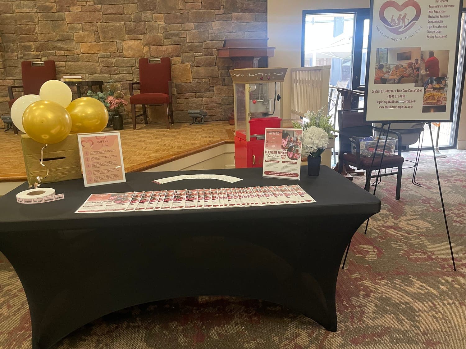 The Healthcare Support Home Care information table set up at a community venue